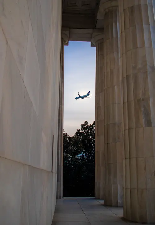 Plane passing the Lincoln Memorial in Washington DC, USA